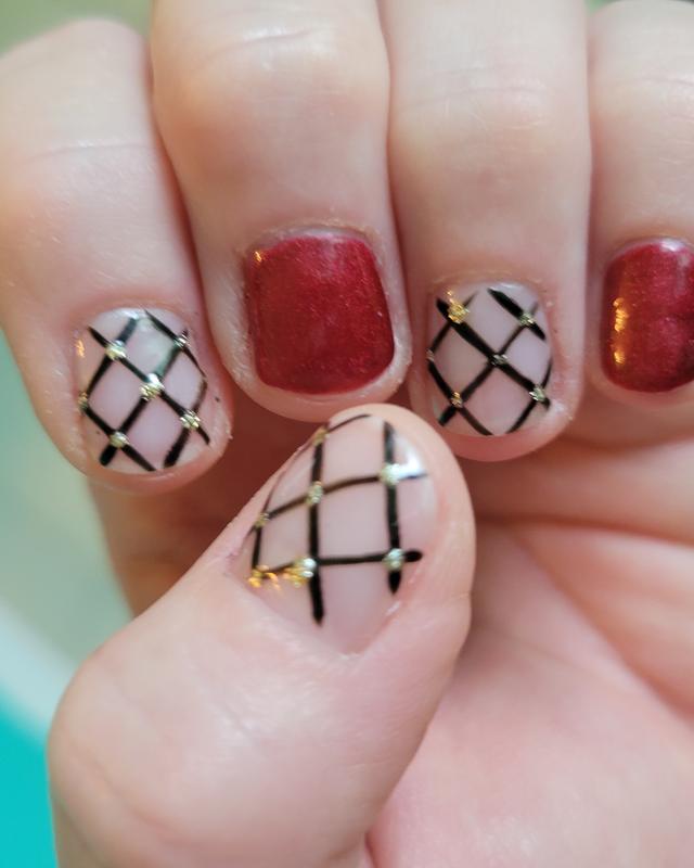 Gold lattice and red glitter nail art