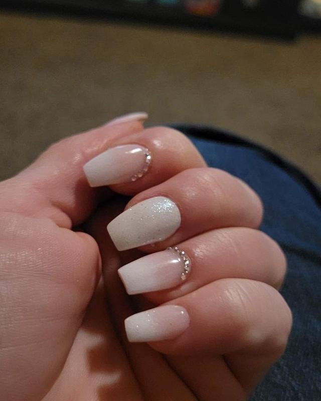 Nude coffin nails with a small gem accent