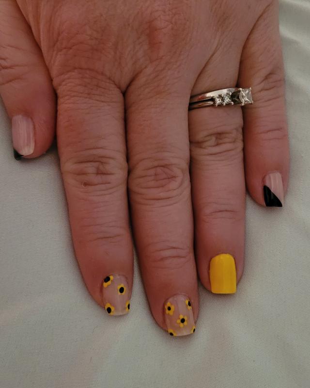 Nude nails with yellow and dotted accents