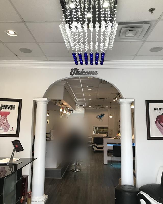 The Welcome arch under the chandelier
