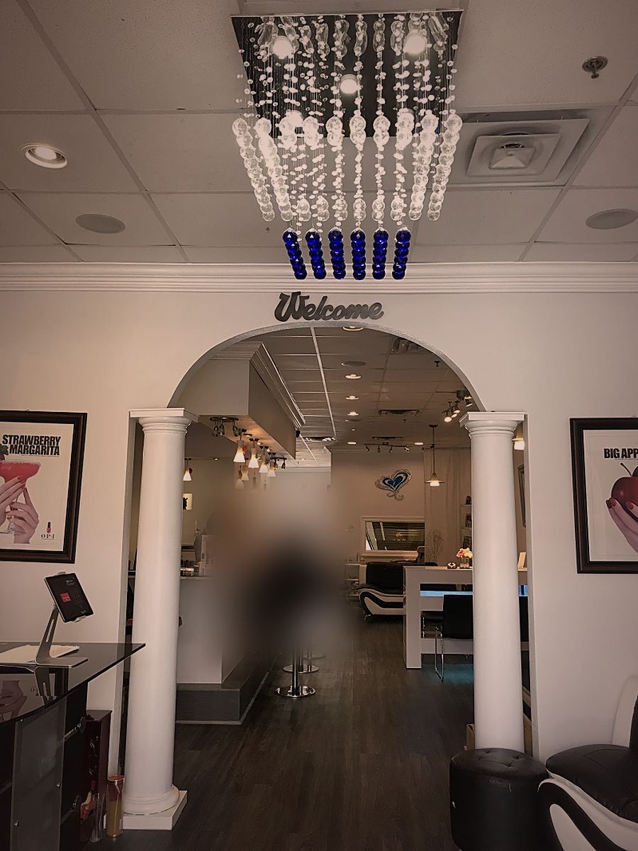 The Welcome arch under the crystal chandelier inside the salon