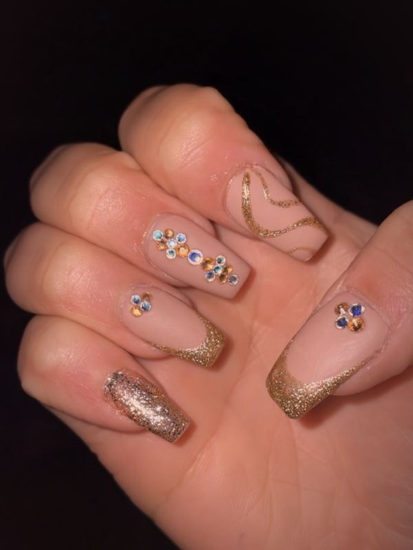 A client set: gold glitter tips with crystals