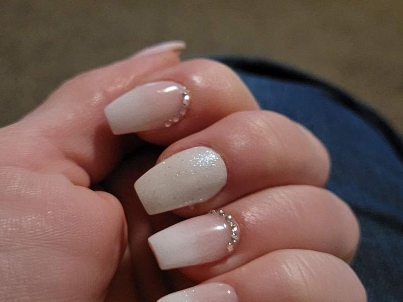 Nude coffin nails with a small gem accent